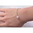 Bracelet Neptune en argent 925 avec perles blanches et bleutées – Élégance marine et intemporelle Bracelet Neptune en argent 925 avec perles blanches et bleutées – Élégance marine et intemporelle