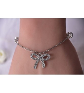Bracelet argenté : Chaîne , perles strass et nœud élégant