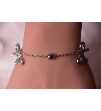Bracelet argenté avec nœuds en strass et perles platines