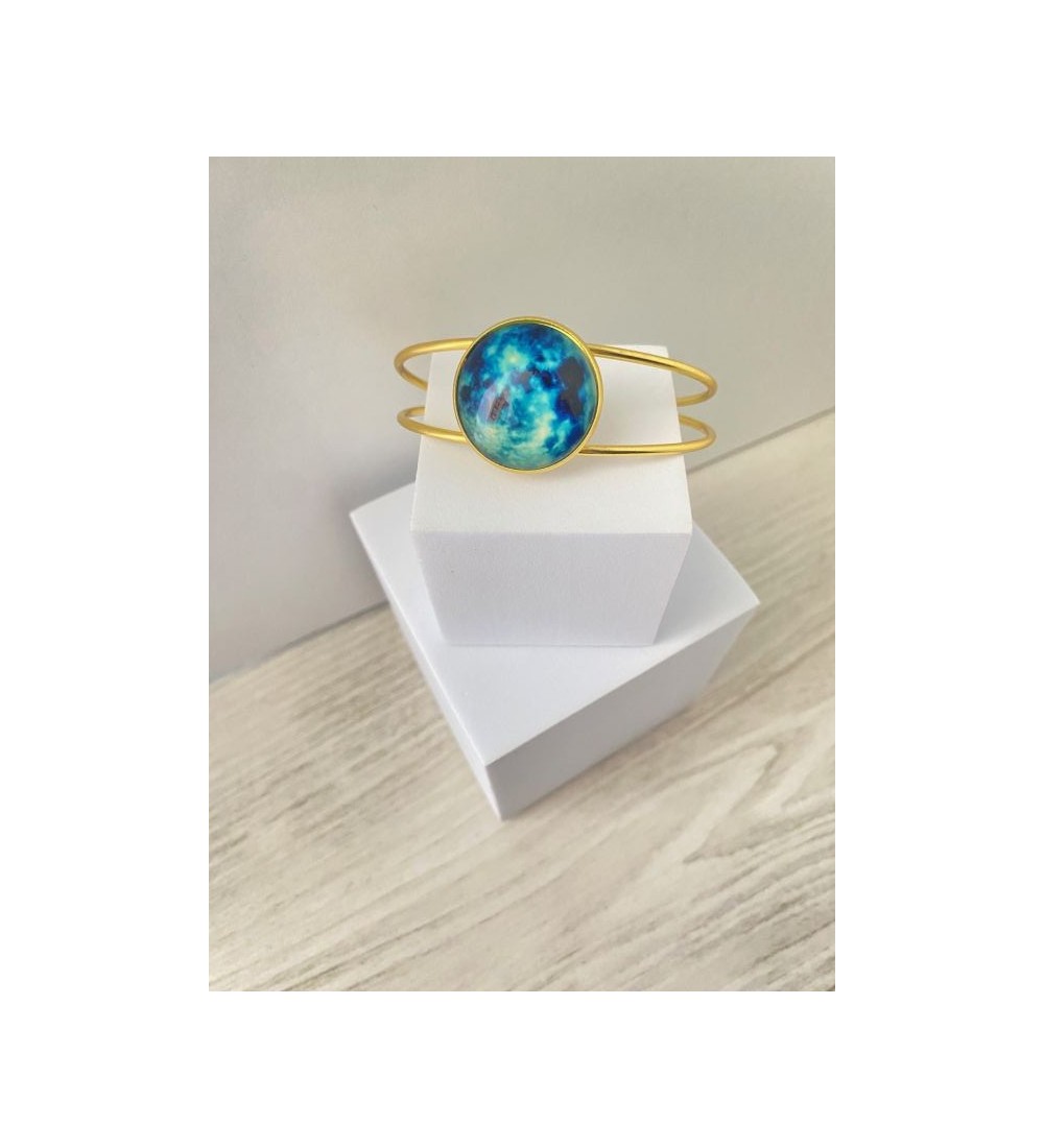 Bracelet jonc ajustable or 24 k avec pendentif bleu nuit