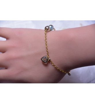 Bracelet doré avec pendentif cœur et perles élégantes