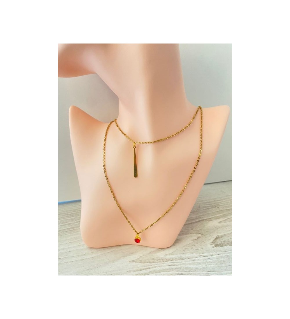 Collier double chaîne or avec pendentif et pierre rouge
