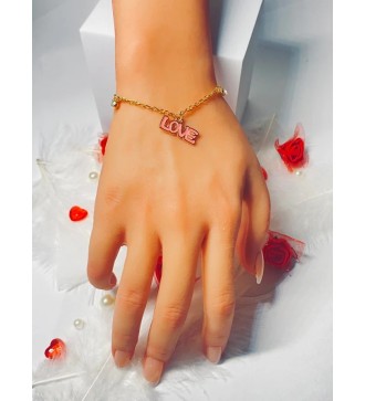 Bracelet doré avec pendentif "LOVE" et breloque strass