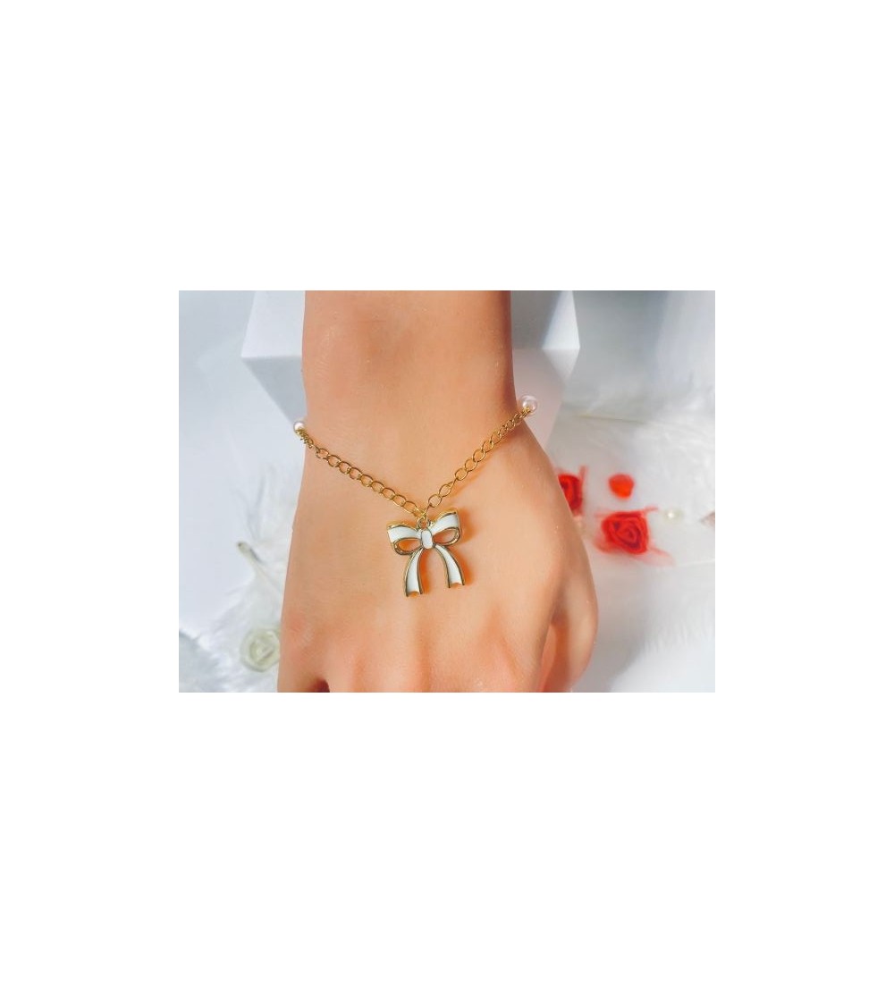 Bracelet doré avec pendentif nœud et formes octogonales