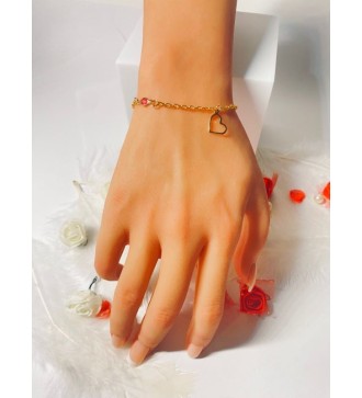 Bracelet doré avec pendentif cœur et perles élégantes