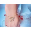 Noeud Lié – Bracelet ajustable perles rouges et pendentif acier inoxydable doré Noeud Lié – Bracelet ajustable perles rouges et pendentif acier inoxydable doré