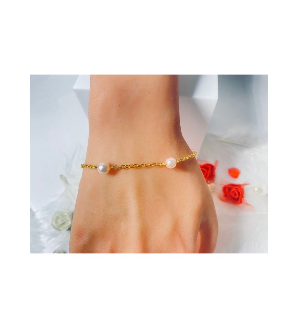 Bracelet doré en acier avec perles couleur pêche