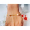 Bracelet doré en acier avec perles couleur pêche élégantes Bracelet doré en acier avec perles couleur pêche élégantes