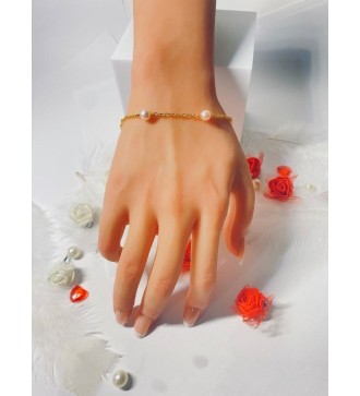 Bracelet doré en acier avec perles couleur pêche