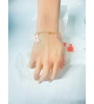 Bracelet doré avec perles bicolores et pendentif rose