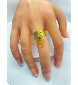 Bague ajustable en acier or avec pendentif fleur et pierre