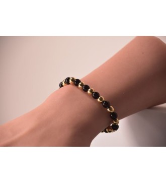 Bracelet en perles noires et dorées , chic et élégant