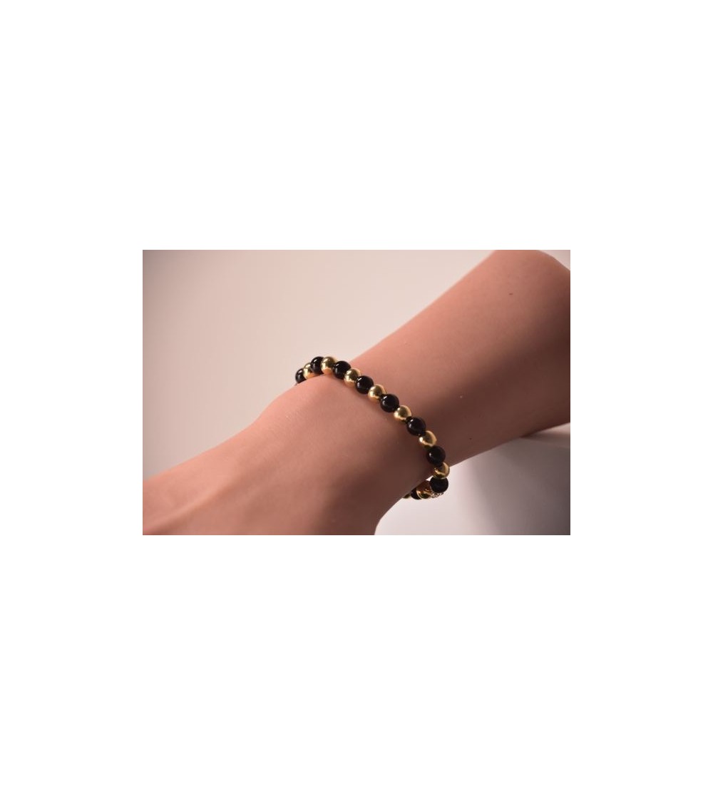 Bracelet en perles noires et dorées , chic et élégant