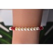 Bracelet Crispation d'amour en perles blanches et rouges Bracelet Crispation d'amour en perles blanches et rouges