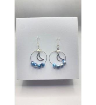 Boucles d'oreilles créoles argentées avec perles bleues