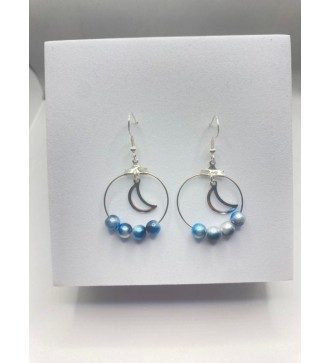 Boucles d'oreilles créoles argentées avec perles bleues