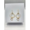 Coeurs Entrelacées – Boucles d’oreilles créoles plaqué or 24 K avec pendentif double cœur entrelacé Coeurs Entrelacées – Boucles d’oreilles créoles plaqué or 24 K avec pendentif double cœur entrelacé