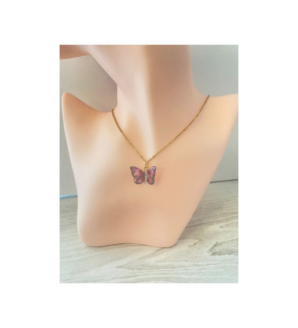 Collier or papillon à strass